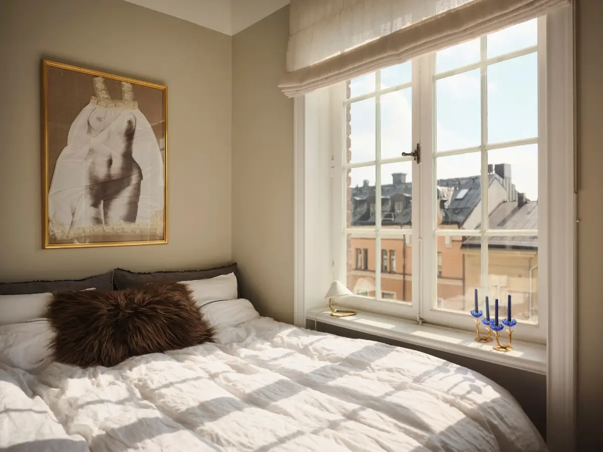 Warm Pink Walls and a Glass Room Divider in a Small Stockholm Apartment 23 tiny bedroom large window