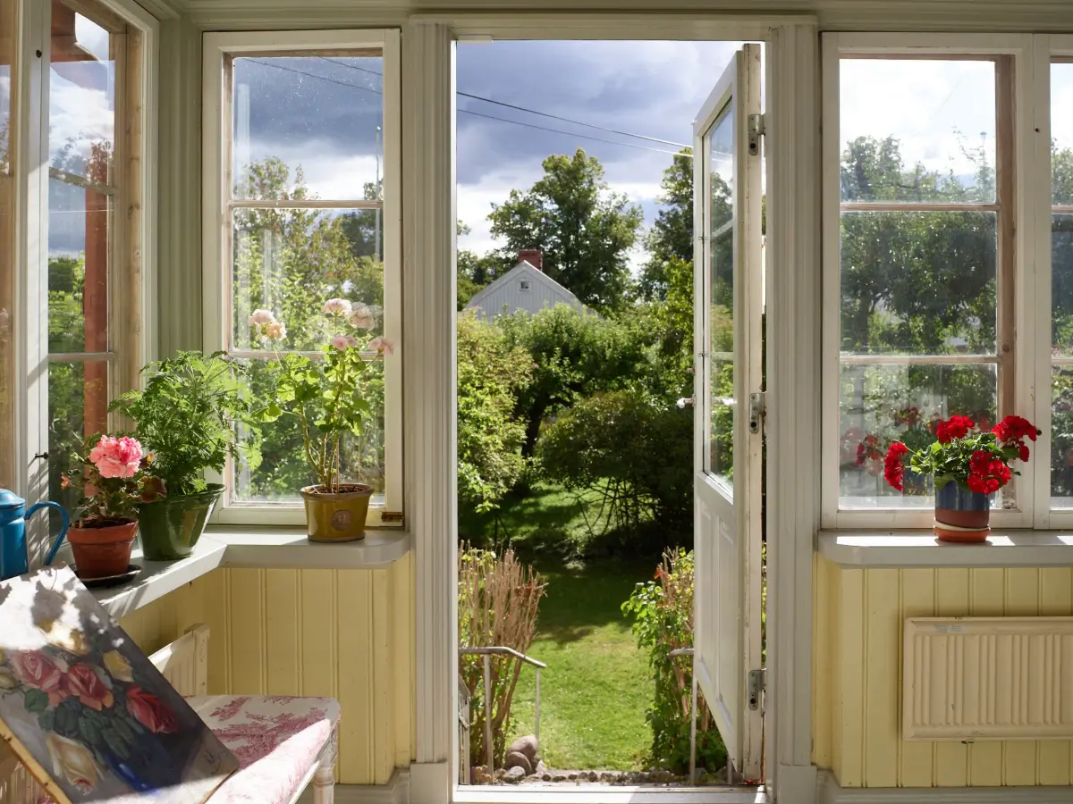 A Well-Preserved 1920s House with a Green Kitchen in Stockholm 41 veranda garden door