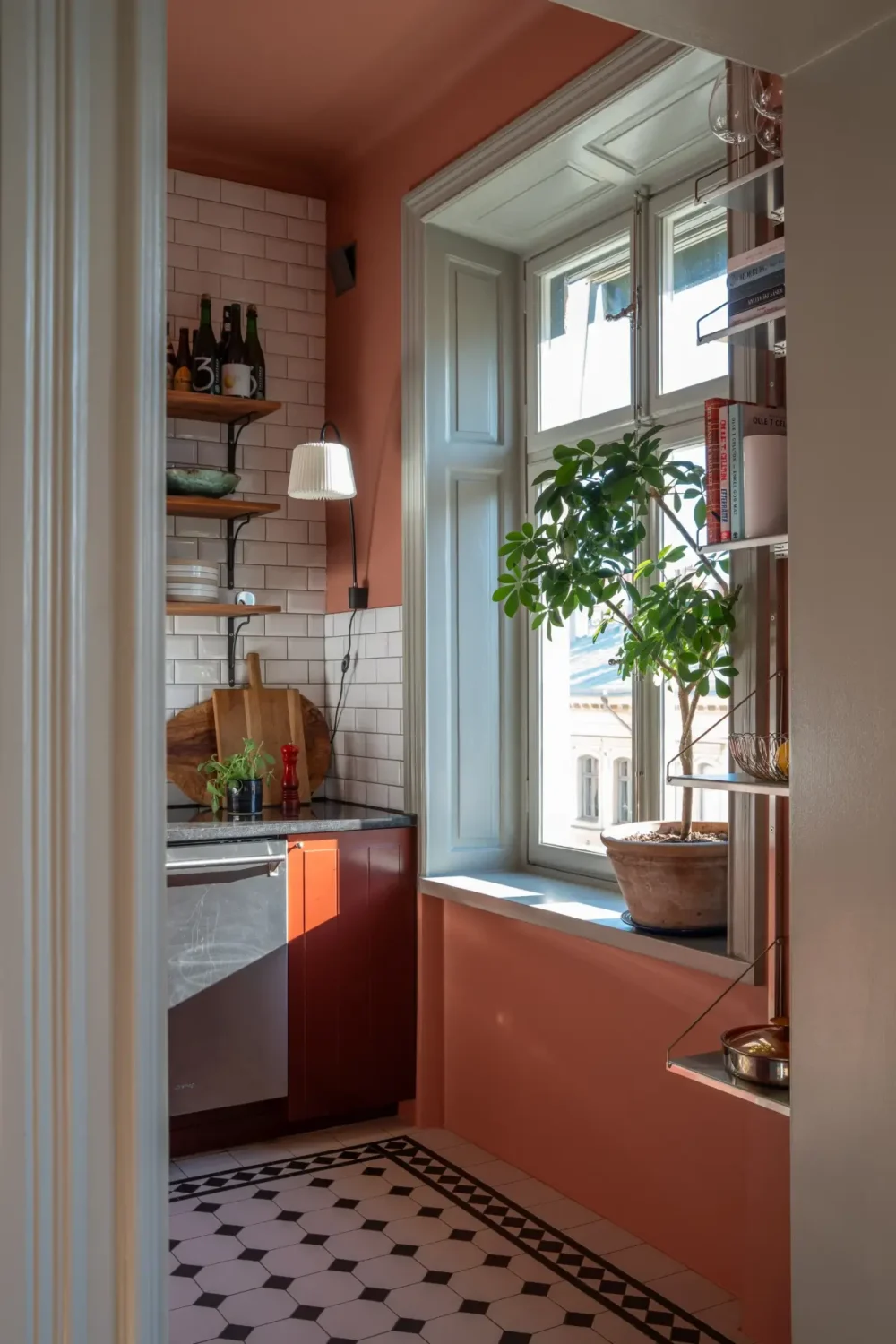 Historic Elegance and a French-Style Kitchen and Bathroom in a Stockholm Apartment 14 view into kitchen pink walls classic victorian-style floor tiles