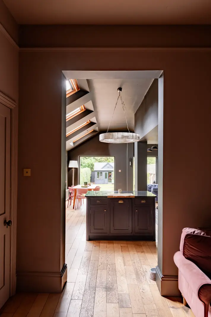 A Dramatic Color Palette in a Large Victorian Family Townhouse 14 view into kitchen