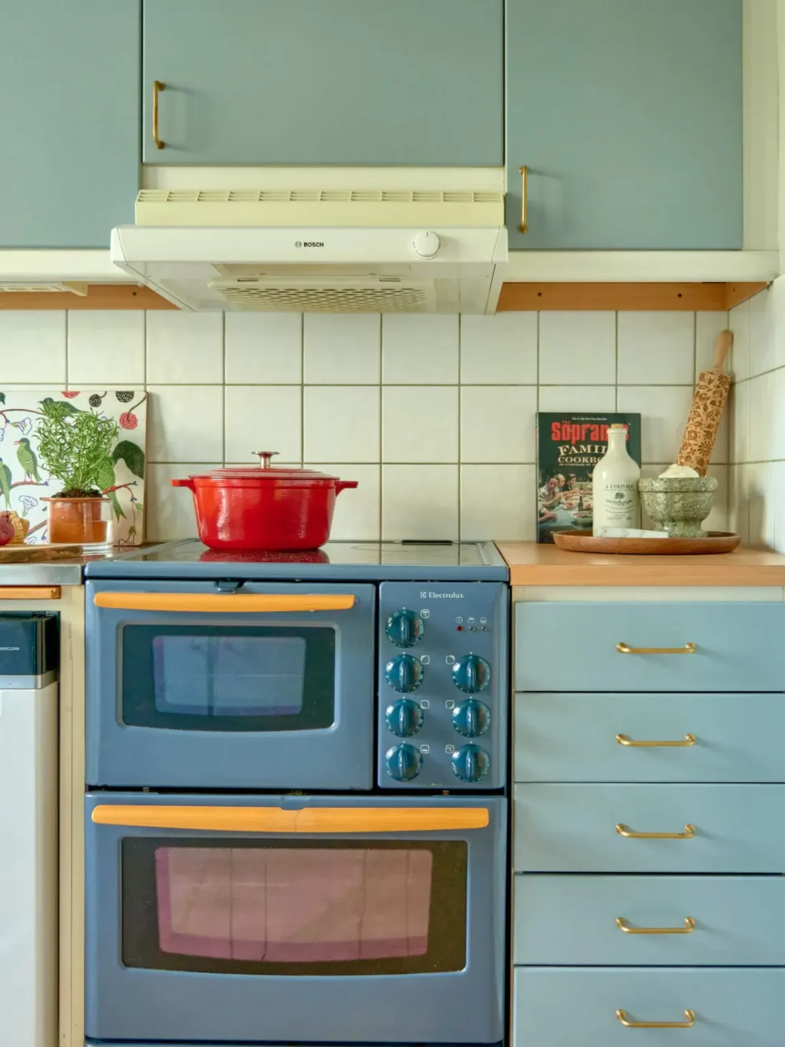 A Colorful and Cozy Midcentury Apartment in Stockholm 12 vintage blue kitchen