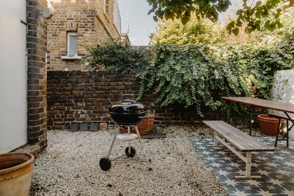Shades of Blue and Original Details in a Victorian Garden Apartment 18 walled garden