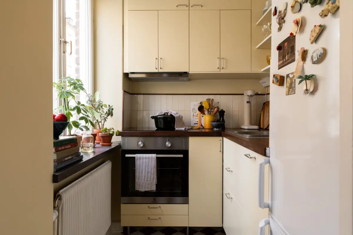 A Warm Beige Studio Apartment with a Butter-Yellow Kitchen 17 warm-beige-studio-apartment-yellow-kitchen-nordroom9