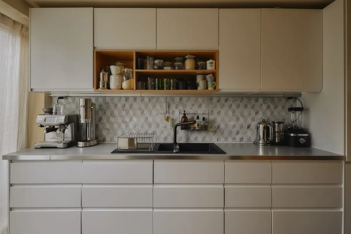 Modern Craftsmanship and Historic Charm in a London Home 10 white kitchen cabinets geometric backsplash tiles