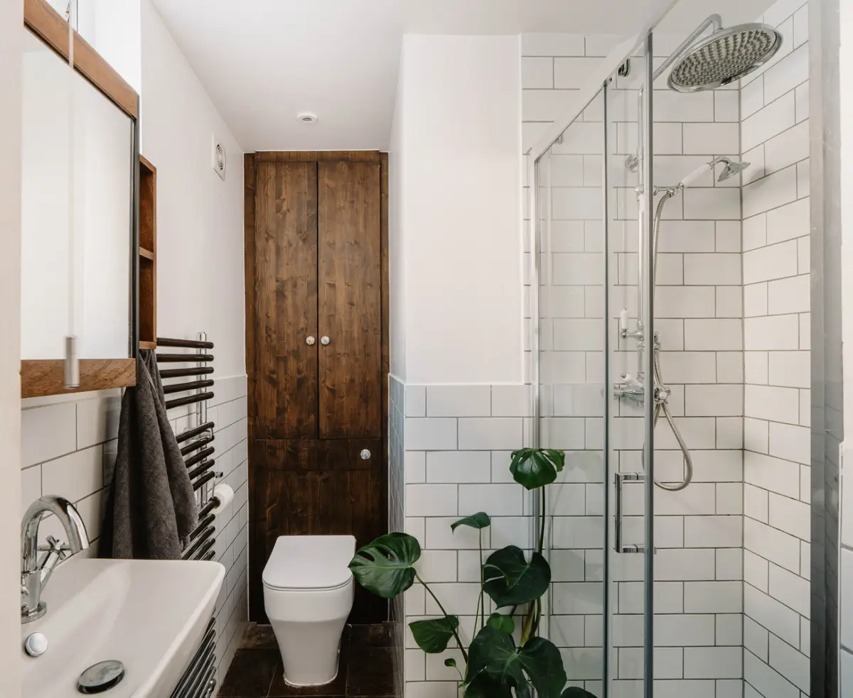 Shades of Blue and Original Details in a Victorian Garden Apartment 13 white-tiled bathroom