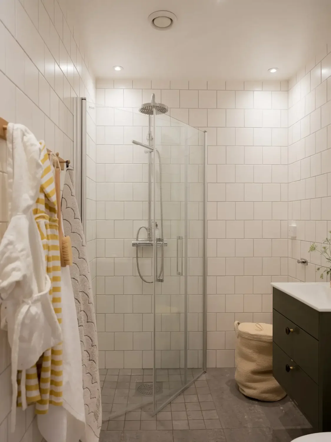 A Cozy Apartment with Exposed Brick and Period Details 28 white-tiled bathroom