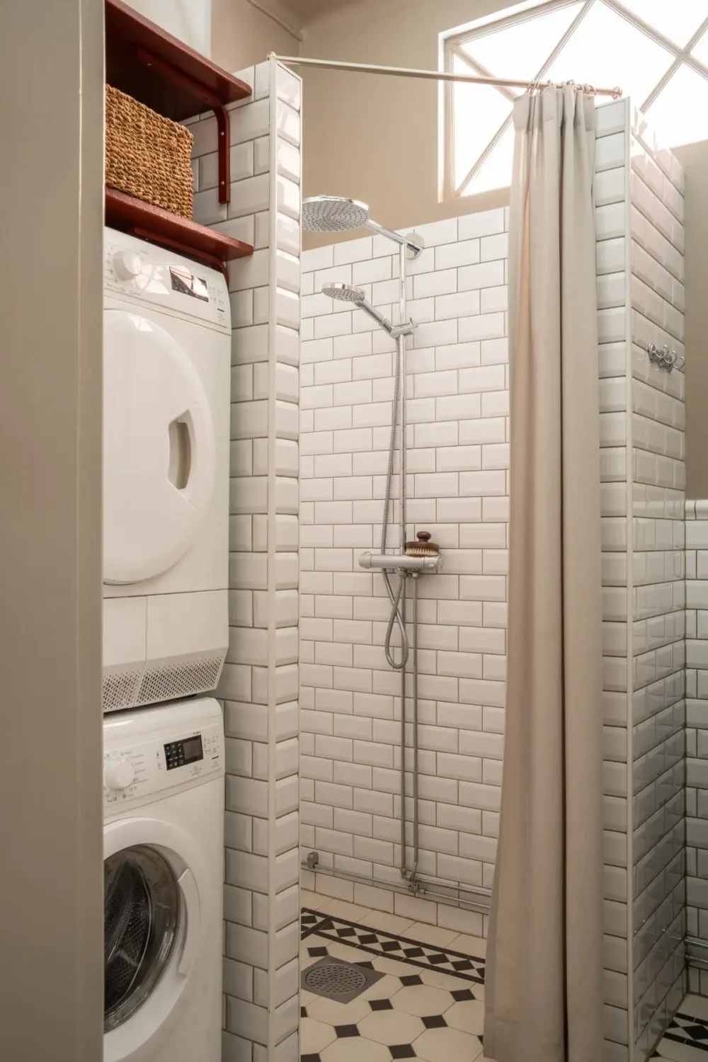 Historic Elegance and a French-Style Kitchen and Bathroom in a Stockholm Apartment 38 white-tiled bathroom niche for washer and dryer nordroom