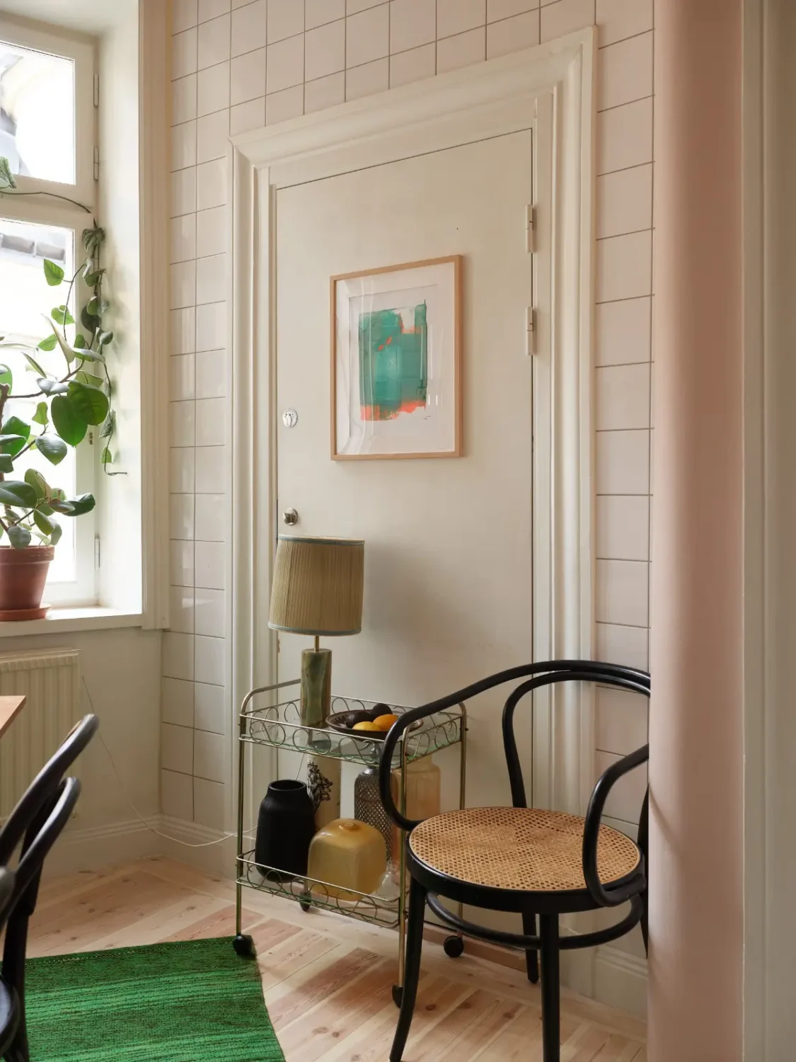 A Spacious Family Apartment with Original Details in Stockholm 20 white tiled kitchen nook