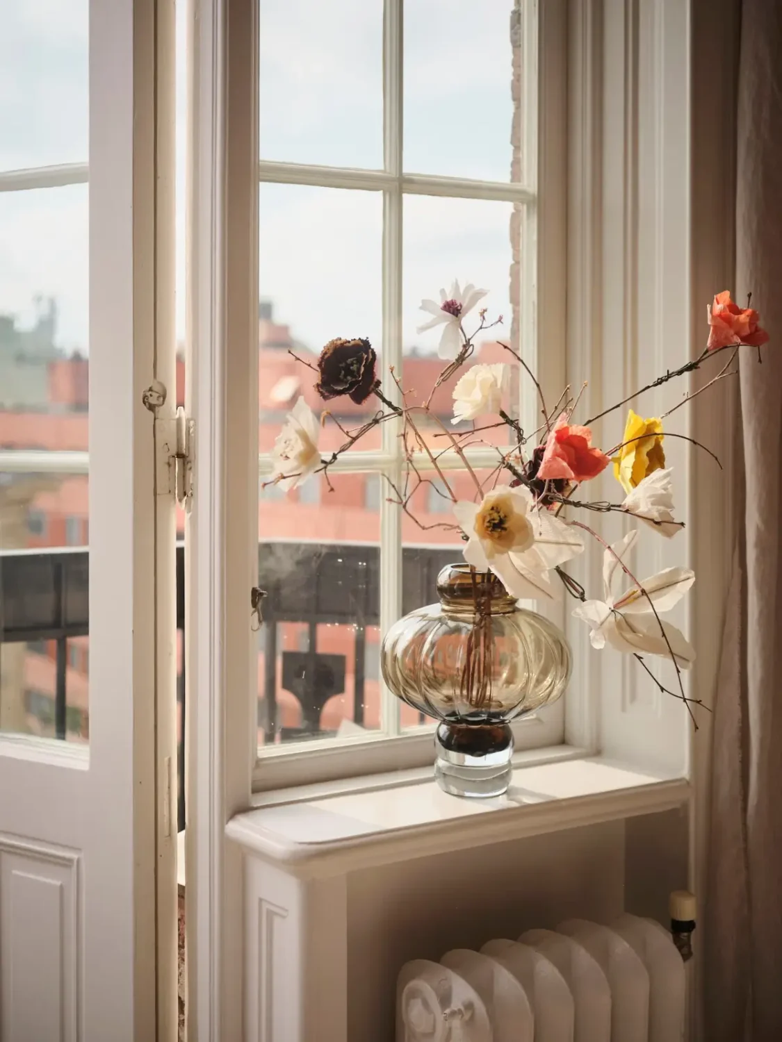 Warm Pink Walls and a Glass Room Divider in a Small Stockholm Apartment 12 window detail