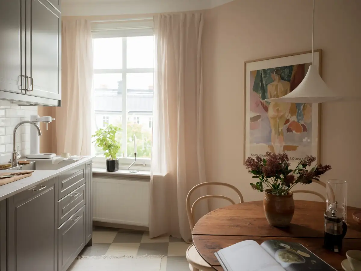 A Cozy Apartment with Exposed Brick and Period Details 20 wooden kitchen table checkerboard floor