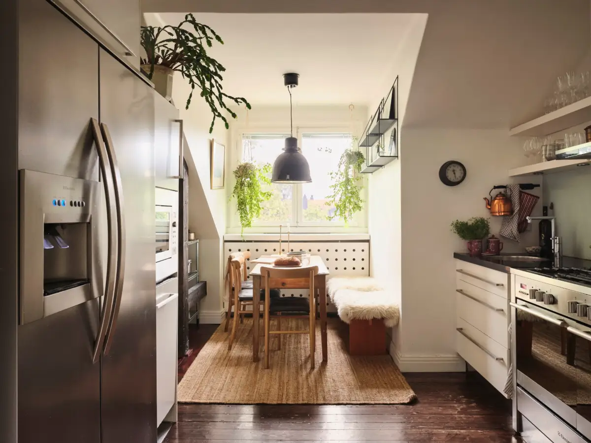 Exposed Beams and Dark-Stained Floorboards in a Cozy Attic Apartment 12 wooden kitchen table with bench