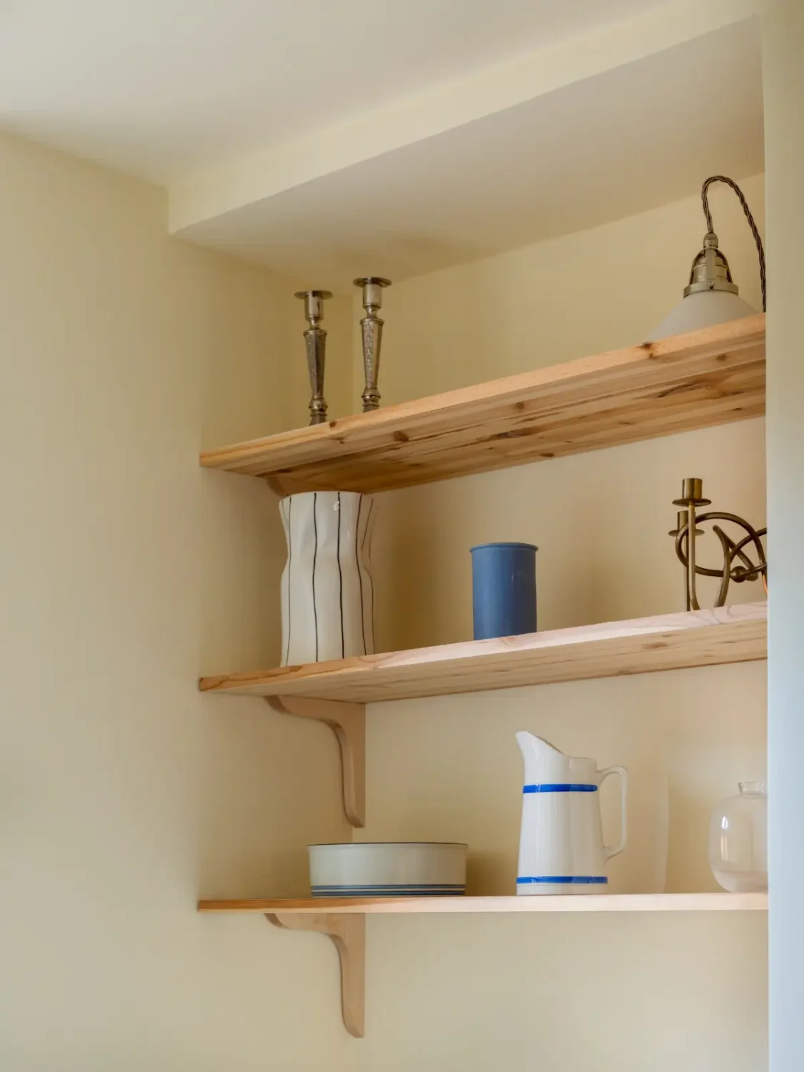 A Bright Apartment Where Historic Character Meets Contemporary Design 24 wooden shelves