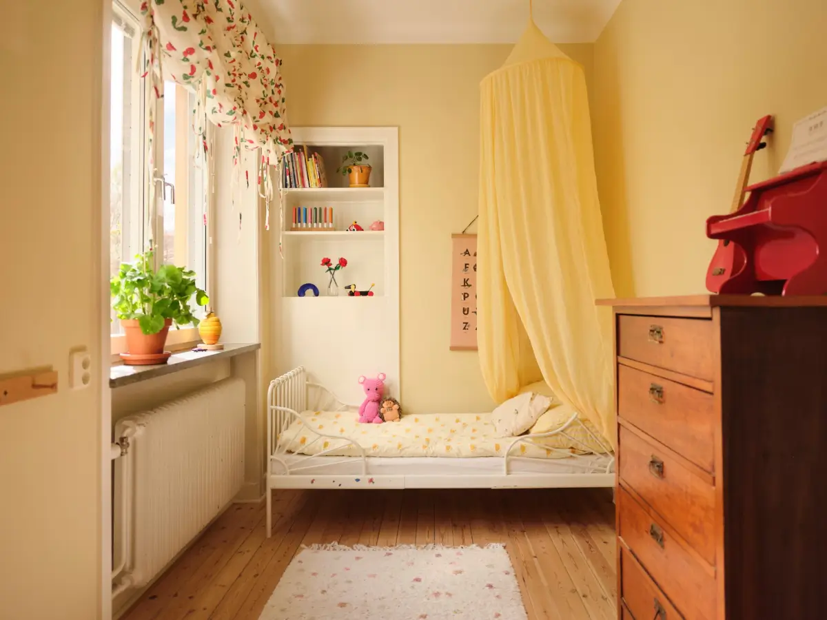 Soft Beige Interiors with the Occasional Bright Color Pop in Stockholm 24 yellow kids bedroom wooden floor