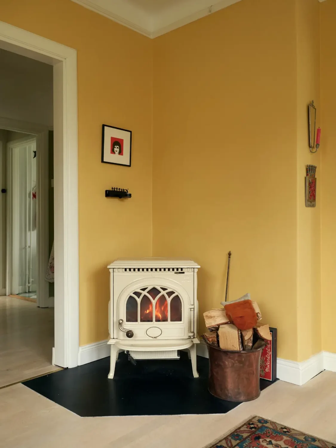 A Cheerful Color Palette in an Early 20th Century Villa in Stockholm 3 yellow living room fireplace