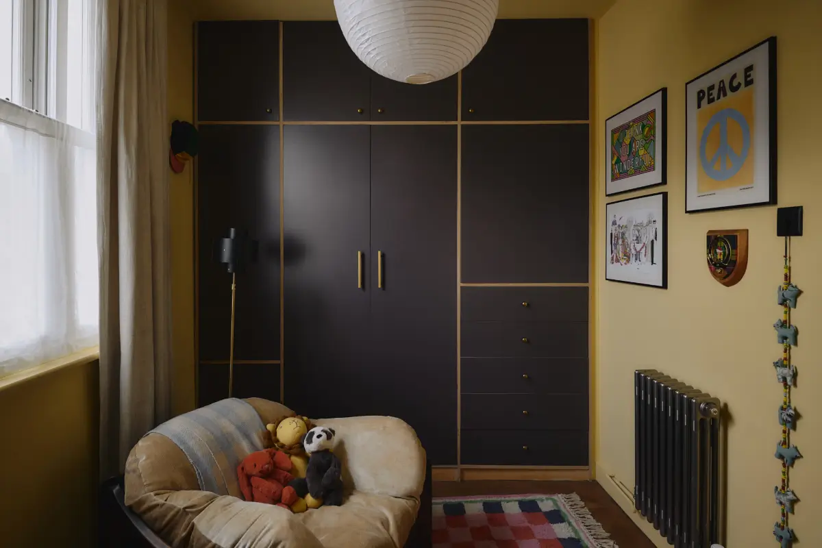 Modern Craftsmanship and Historic Charm in a London Home 23 yellow nursery black built-in wardrobes