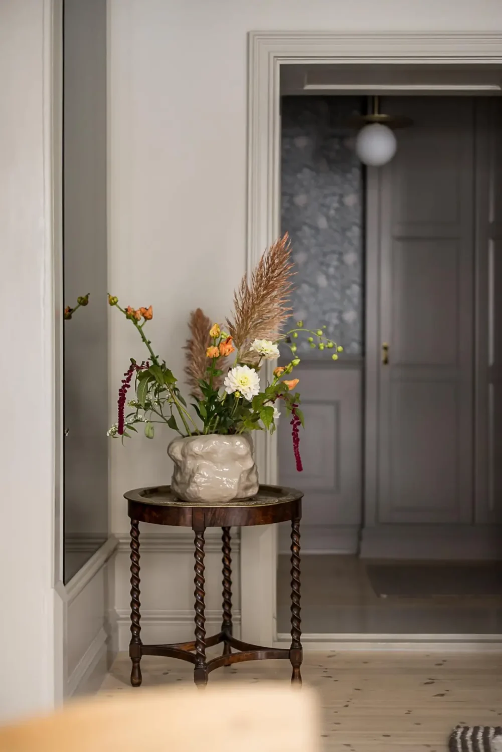 Gray Tones, Wallpapers, and a Mint Green Fireplace in a Swedish Apartment 11 antique side table