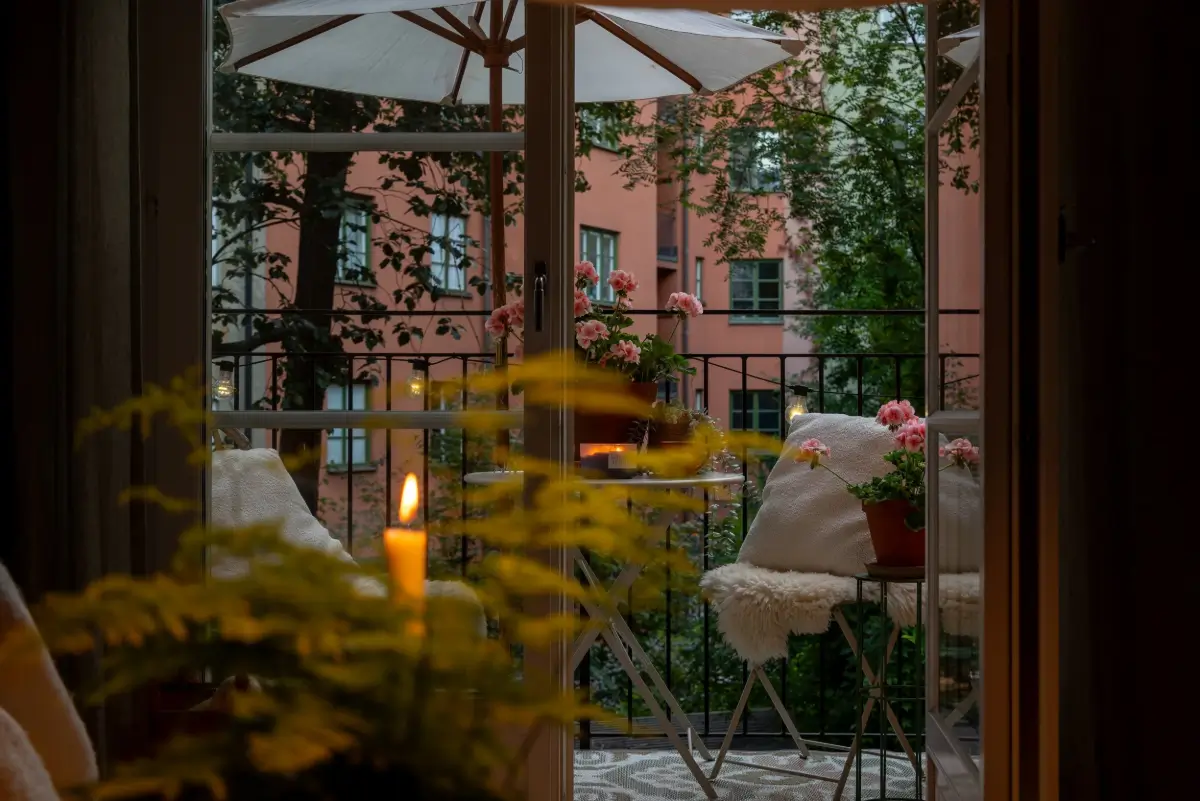 A Gray Kitchen with a Green Marble Countertop in a Small Apartment 10 balcony at night