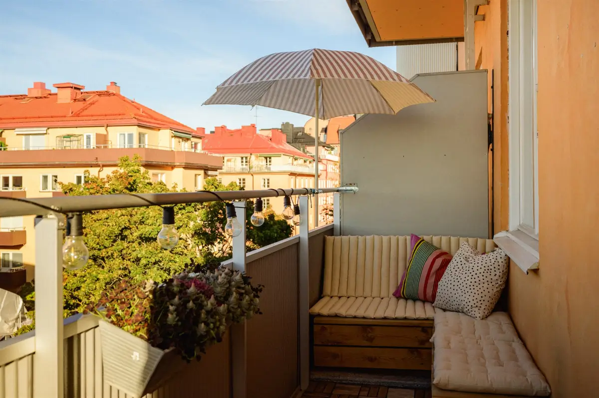 A Colorful Stockholm Family Apartment with Views of the Lake 24 balcony corner bench