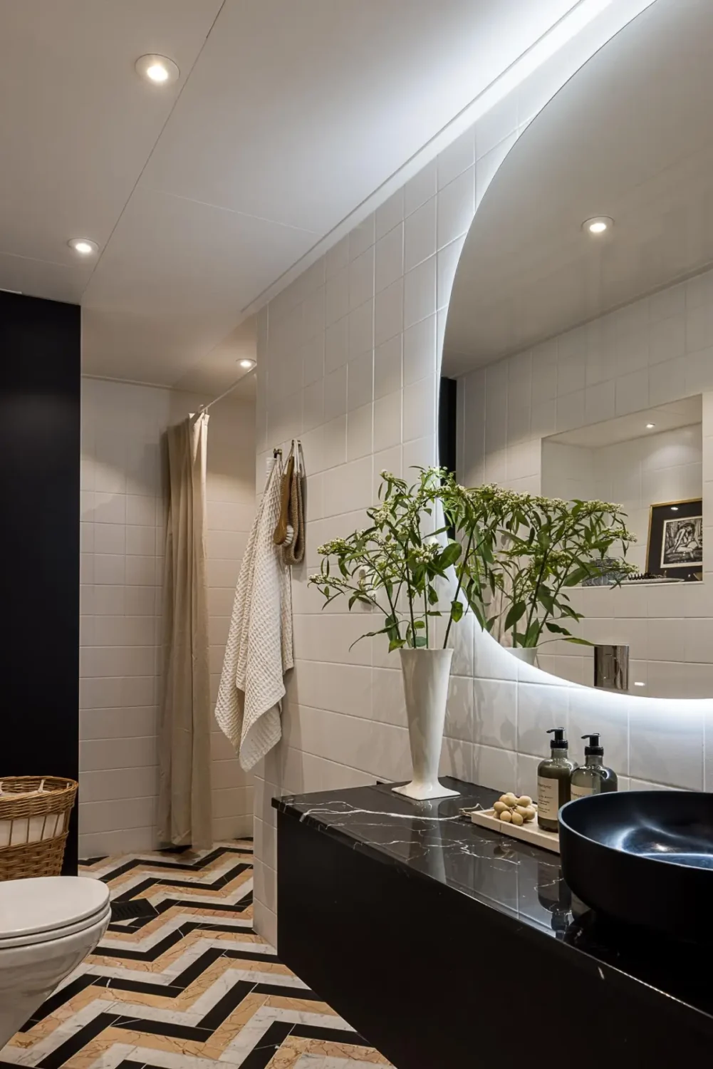Gray Tones, Wallpapers, and a Mint Green Fireplace in a Swedish Apartment 29 bathroom black fittings colorful marble herringbone floor tiles