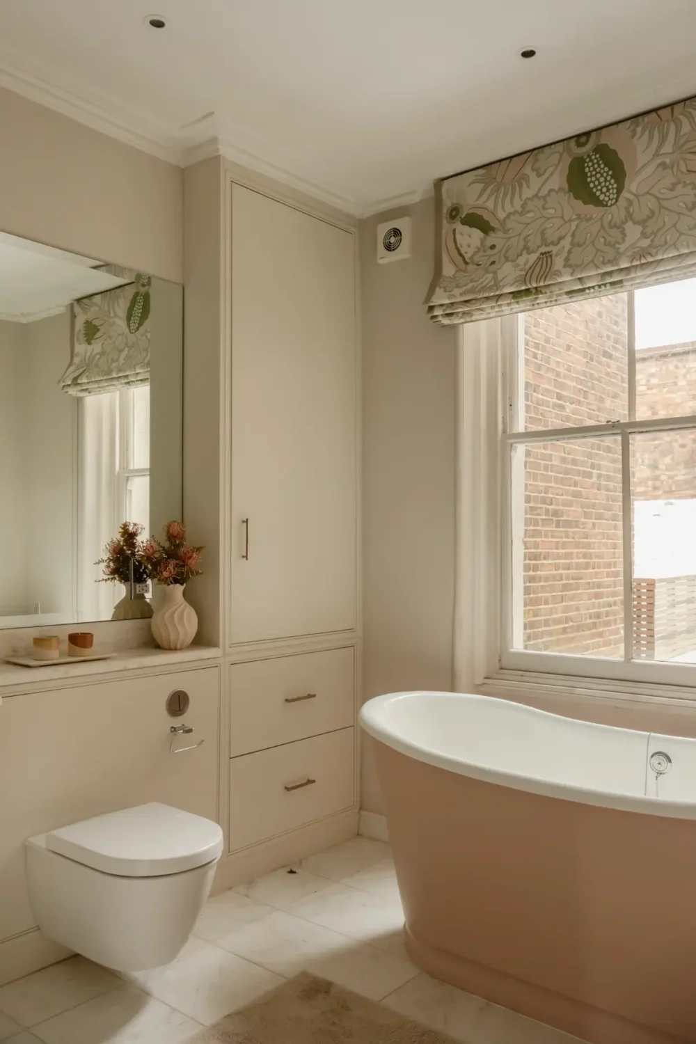 A Serene Duplex Apartment with a Glass Extension in London 27 bathroom pink freestanding bath marble tiles