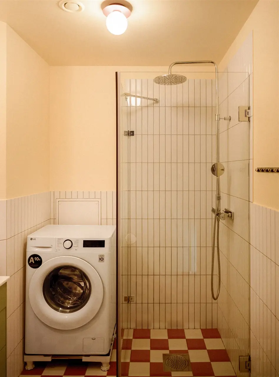A Colorful Stockholm Family Apartment with Views of the Lake 32 bathroom red and white checkerboard floor