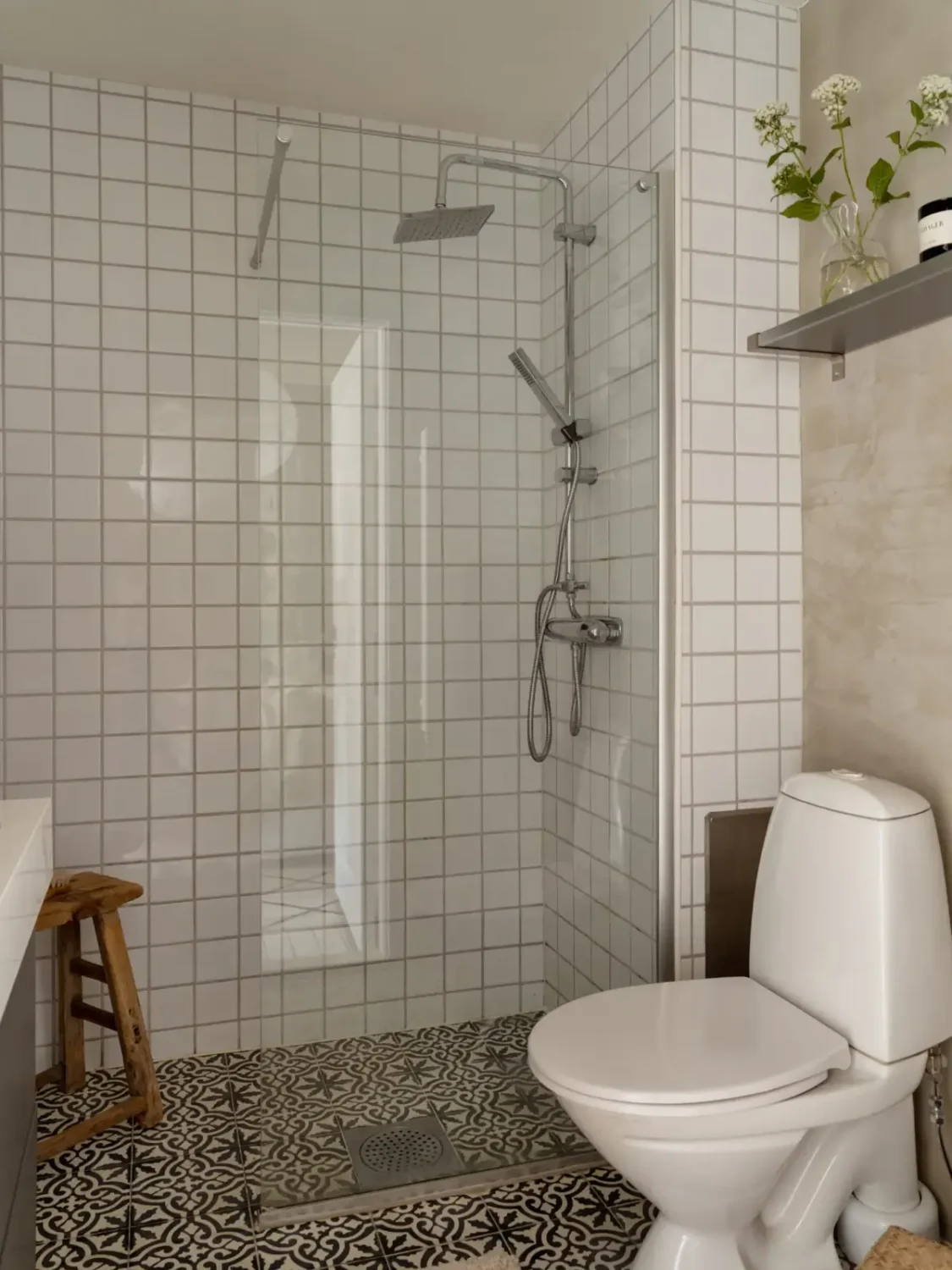 A Fresh 1920s Apartment with White Floorboards and Exposed Brick 23 bathroom shelf above toilet