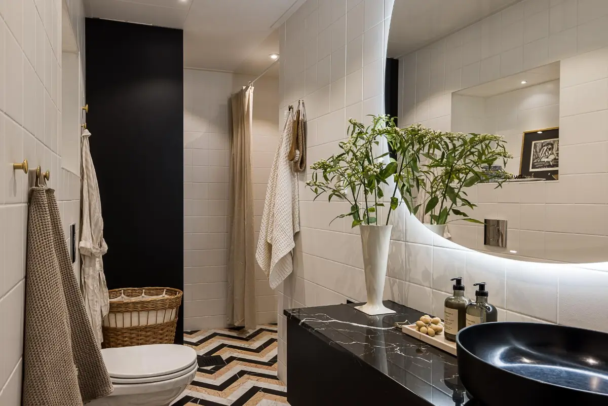 Gray Tones, Wallpapers, and a Mint Green Fireplace in a Swedish Apartment 28 bathroom white tiles marble floor