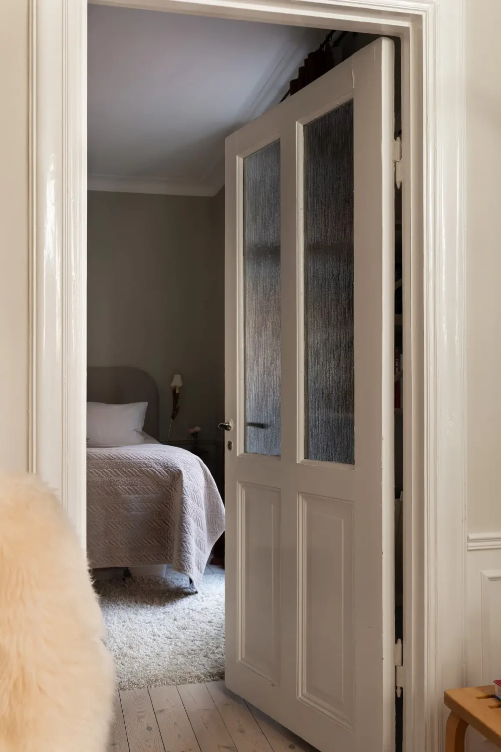 Neutral Tones and Period Character from the 1910s in a Stockholm Apartment 16 bedroom door