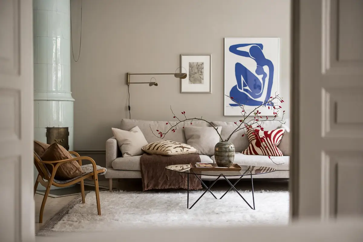 Gray Tones, Wallpapers, and a Mint Green Fireplace in a Swedish Apartment 15 bedroom view into living room