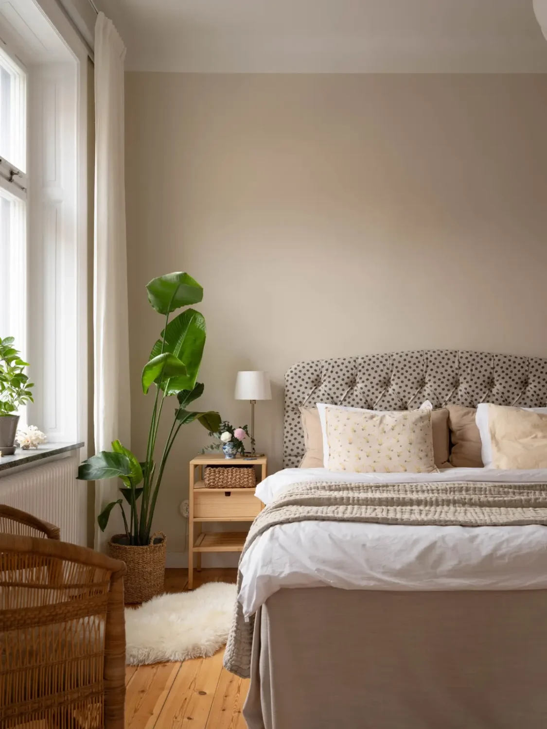 A Light and Spacious Corner Apartment in a 19th-Century Building 20 bedroom warm beige walls polkadot headboard