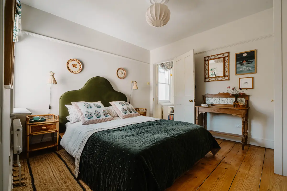 Cozy Interiors in a Restored 19th Century Family Home in Tunbridge Wells 21 bedroom wooden floorboards green velvet headboard
