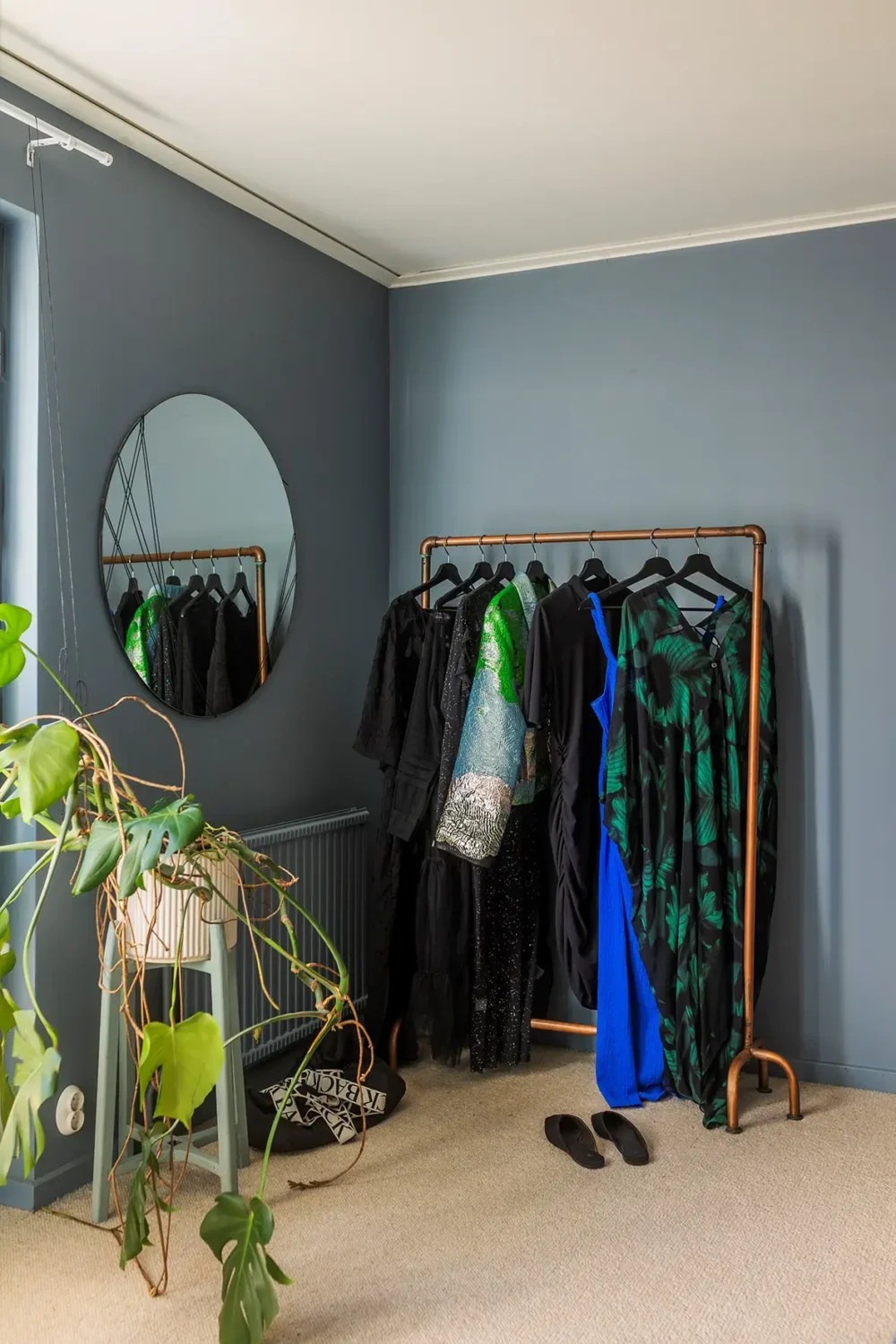 A Charming 1960s Family Home in Stockholm 27 blue bedroom clothing rack