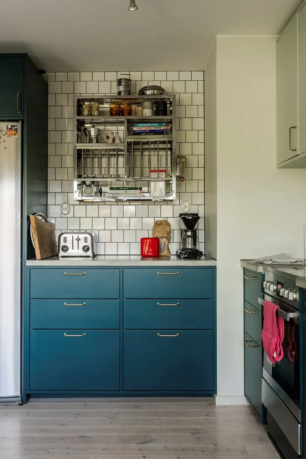 A Charming 1960s Family Home in Stockholm 8 blue kitchen cabinets white tiles