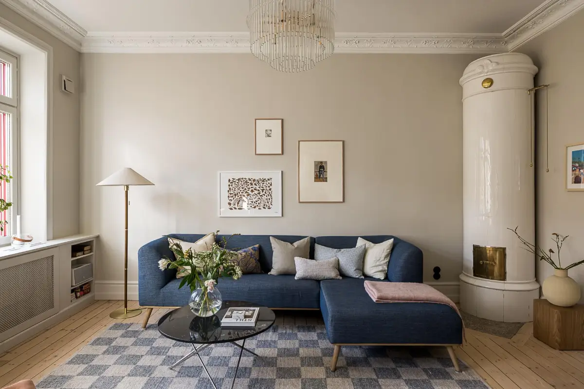 A Classic Renovated Apartment with a Social Light Green Kitchen 4 blue living room sofa