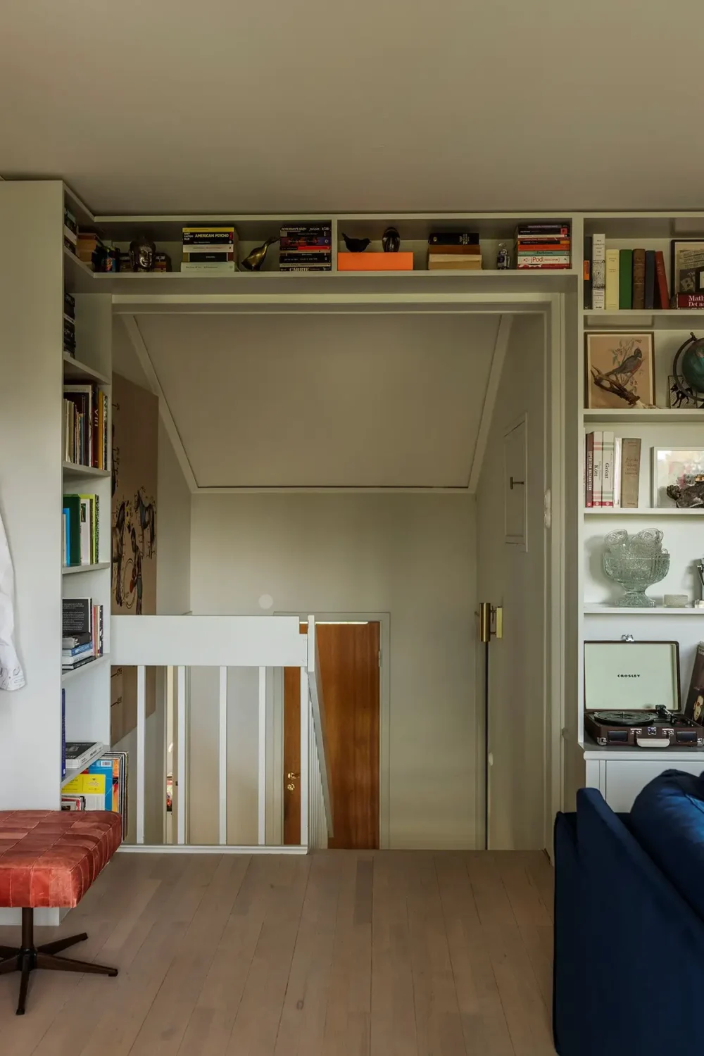 A Charming 1960s Family Home in Stockholm 23 bookshelves above doorframe