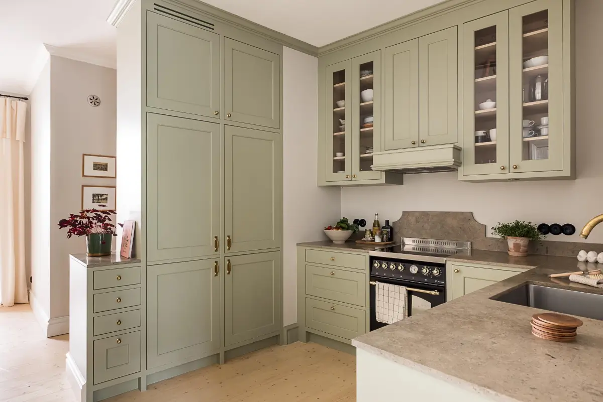 A Classic Renovated Apartment with a Social Light Green Kitchen 22 built-in kitchen cabinets