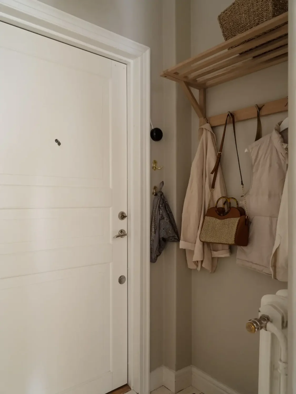 A Fresh 1920s Apartment with White Floorboards and Exposed Brick 26 coat rack A Fresh 1920s Apartment with White Floorboards and Exposed Brick