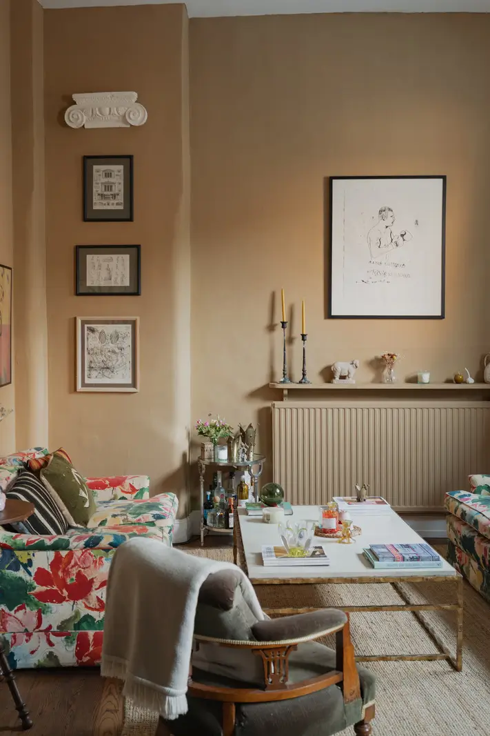 A Charming English Cottage with a Sage-Green Kitchen 2 cottage living room warm farrow and ball paint floral sofa nordroom