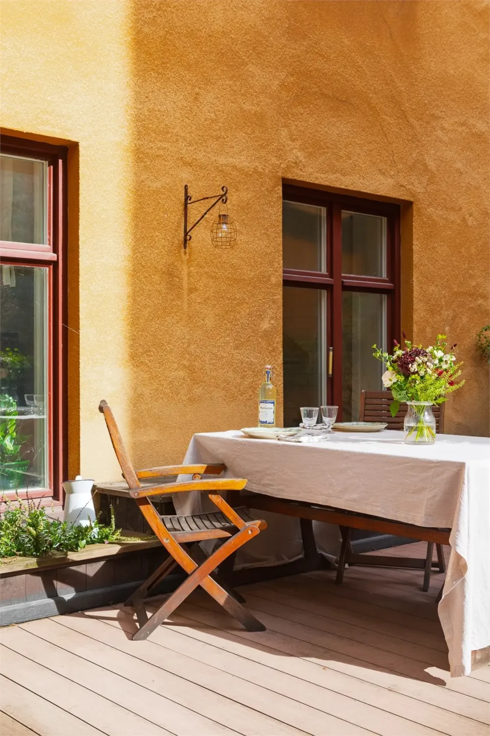 A Light-Filled Stockholm Apartment with a Charming Kitchen 27 courtyard terrace dining table