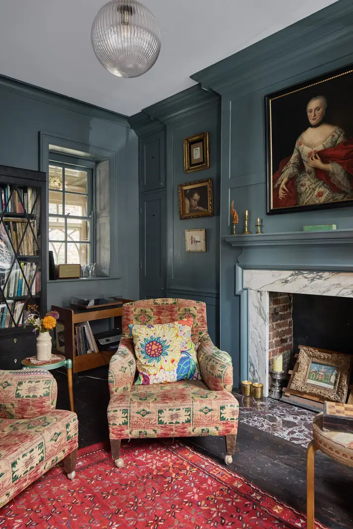 A deVOL Kitchen in a Beautiful Restored Georgian Townhouse in London 10 dark blue sitting room marble fireplace