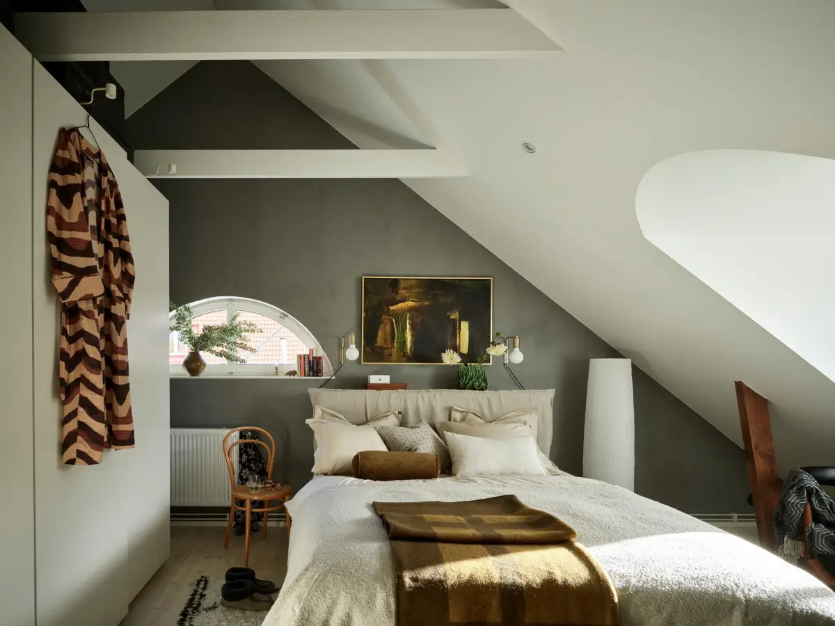 dark gray wallpaper bedroom pitched ceiling exposed beams white wardrobes