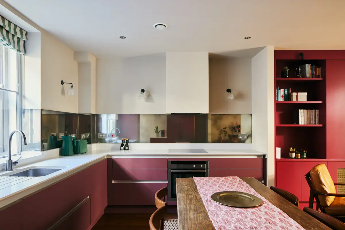 Why Everyone’s Adding Mirrors to Their Kitchens (And You Should Too) 1 deep pink kitchen white countertop mirror backsplash nordroom