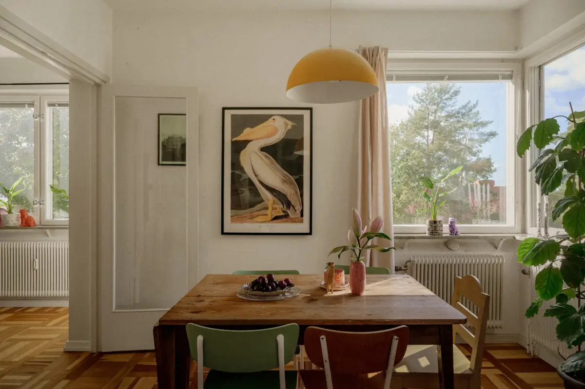 Green Tones and Period Elements in a 1940s Apartment 6 dining room table