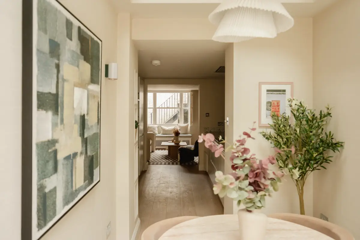 A Serene Duplex Apartment with a Glass Extension in London 19 dining room view into kitchen