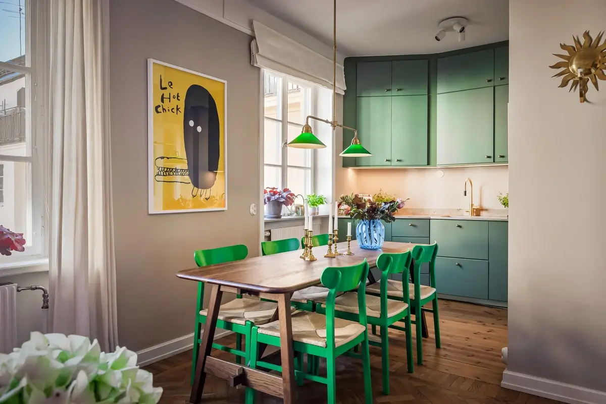 A Colorful Studio Apartment with Gucci Wallpaper 10 dining table green chairs