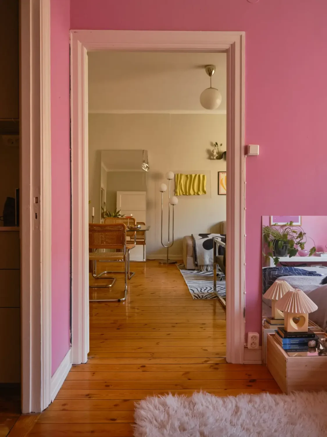 A Light 1930s Apartment with a Bubblegum Pink Bedroom 25 doorway bedroom living room