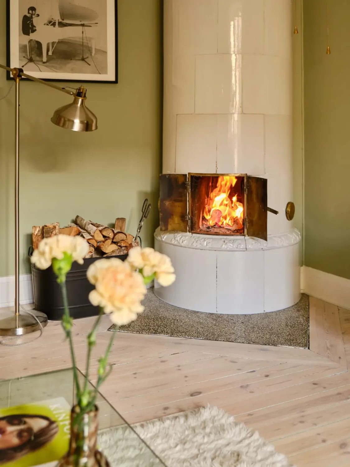 Green and Apricot Rooms in a Charming Stockholm Apartment 11 fireplace detail