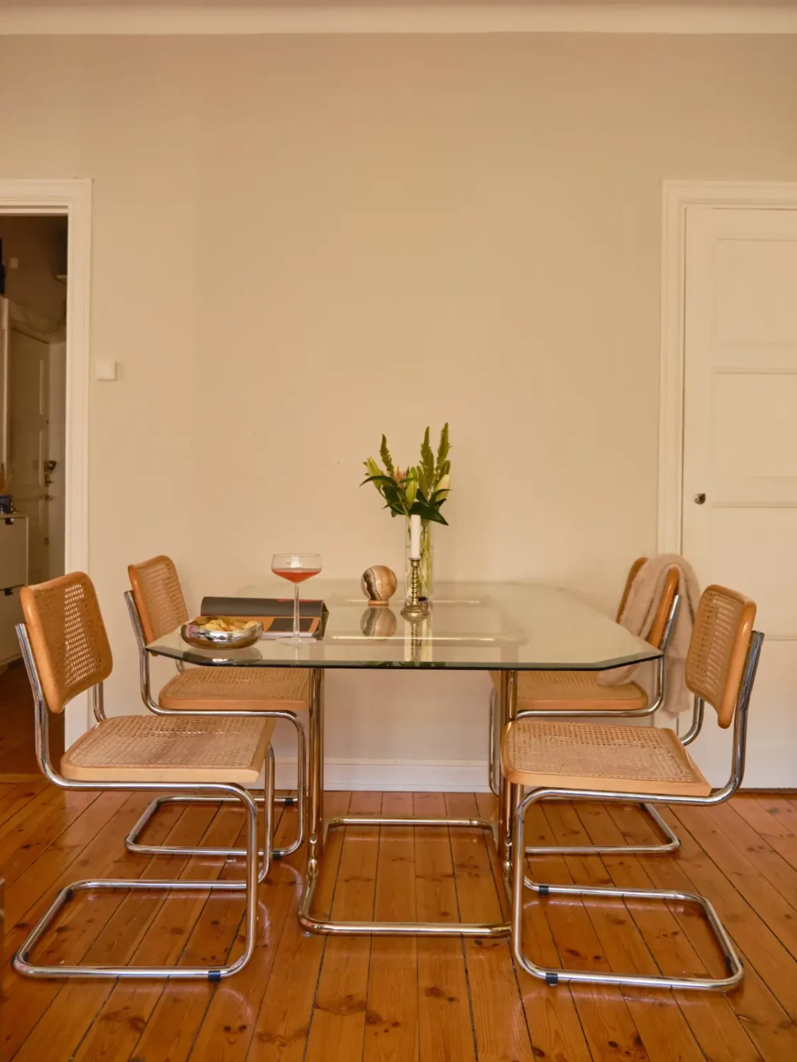 A Light 1930s Apartment with a Bubblegum Pink Bedroom 10 glass dining table