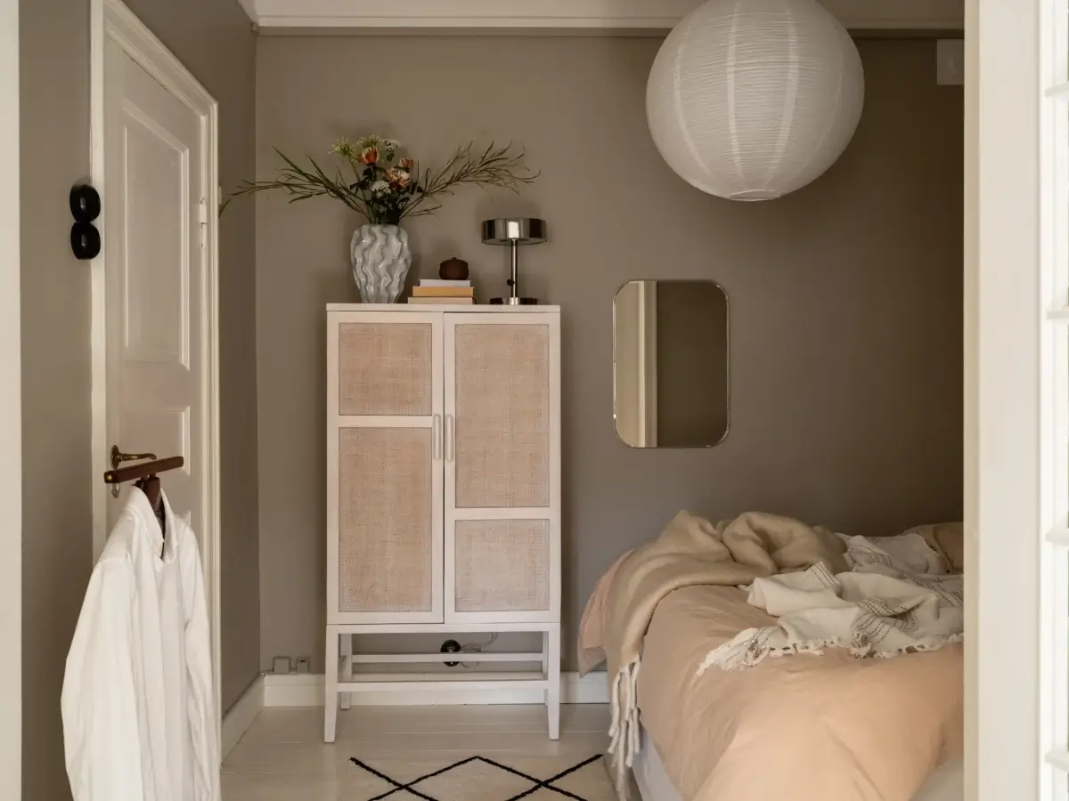 A Fresh 1920s Apartment with White Floorboards and Exposed Brick 16 gray bedroom