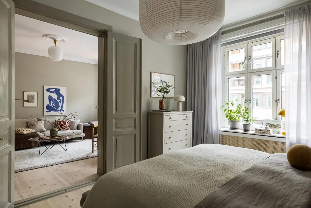 Gray Tones, Wallpapers, and a Mint Green Fireplace in a Swedish Apartment 20 gray bedroom wooden floor double doors